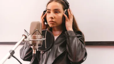 a woman wearing a leather jacket and headphones